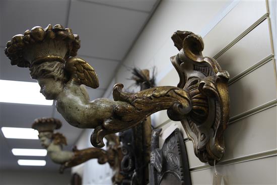A pair of 19th century Italian carved and painted parcel gilt wall scones, 20in.